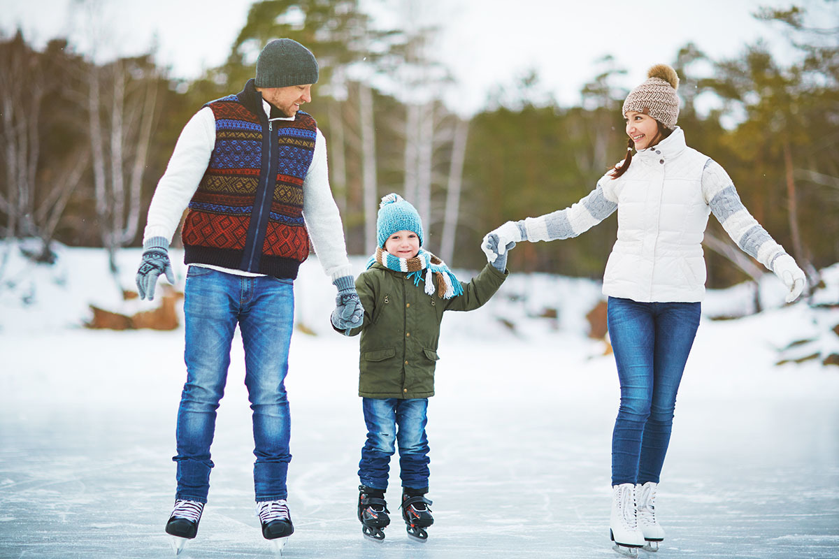 family skating on ice rink