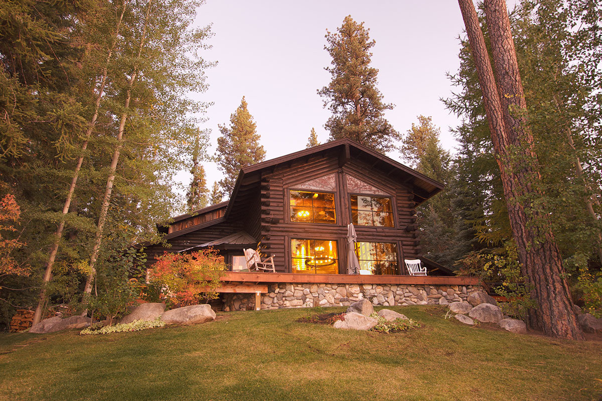 luxury log cabin nestled in the woods
