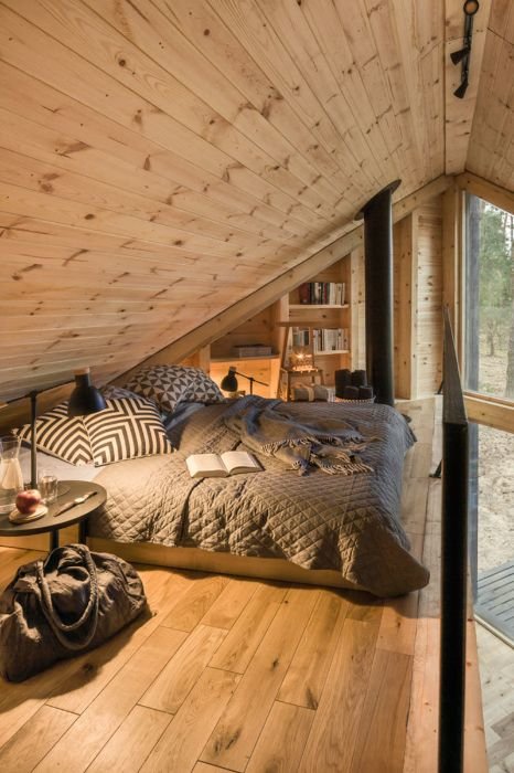 sleeping loft in the bookworm cabin in poland